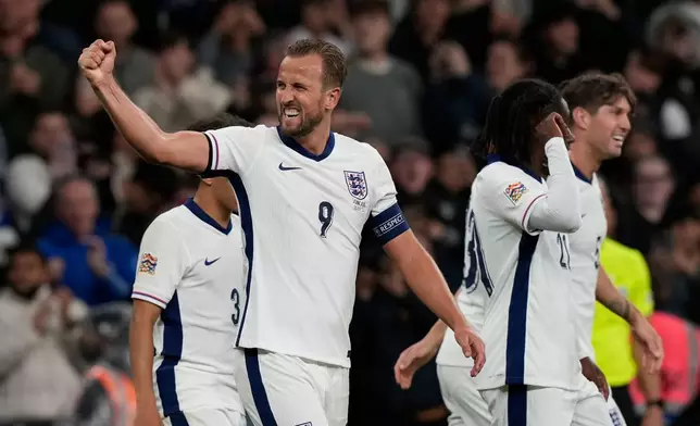 FILE - England's Harry Kane, left, celebrates after scoring his side's second goal during the Group F UEFA Nations League soccer match between England and Finland at Wembley Stadium in London, Tuesday, Sept. 10, 2024. (AP Photo/Frank Augstein, File)