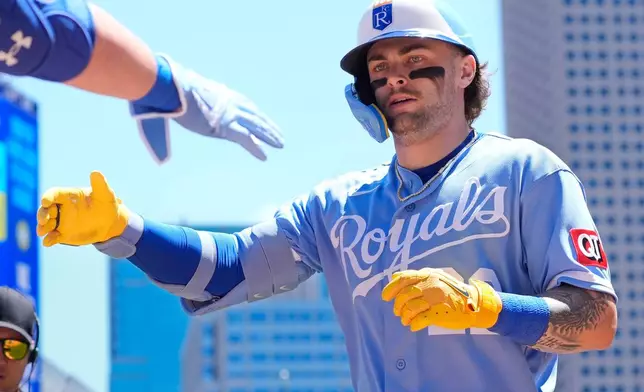 Kansas City Royals' Carter Jensen celebrates his solo home run against the Minnesota Twins in the first inning of a baseball game Saturday, June 6, 2026, in Minneapolis. (AP Photo/Bruce Kluckhohn)