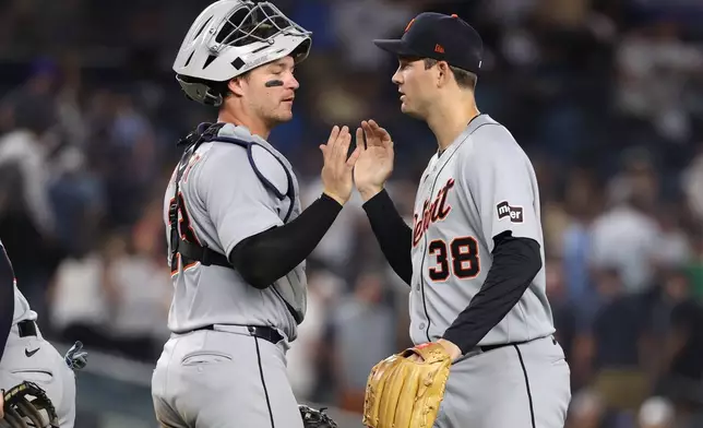 Detroit Tigers' Dillon Dingler, left, and Drew Anderson, right, react after defeating the New York Yankees in a baseball game Monday, June 29, 2026, in New York. (AP Photo/Pamela Smith)