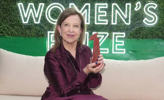 Lyse Doucet, winner of The Women's Prize for nonfiction, poses for a photograph at the Women's Prize Trust Summer Party &amp; Awards Ceremony for the 2026, in London, Thursday, June 11, 2026. (AP Photo/Kin Cheung)