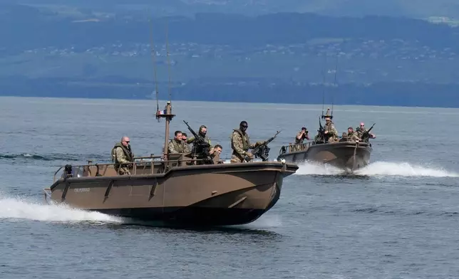 French military boats patrol Lake Geneva in Evian-les-Bains, eastern France, Thursday, June 11, 2026, ahead of the G7 summit scheduled to take place June 15-17. (AP Photo/Baz Ratner)