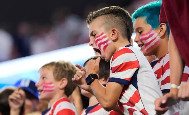 Spectators react following the World Cup Group D soccer match between the United States and Paraguay in Inglewood, Calif., near Los Angeles, Friday, June 12, 2026. (AP Photo/Mark J. Terrill)