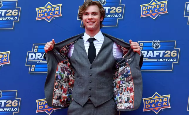 Gavin McKenna arrives on the red carpet before the NHL hockey draft Friday, June 26, 2026, in Buffalo, N.Y. (AP Photo/Adrian Kraus)