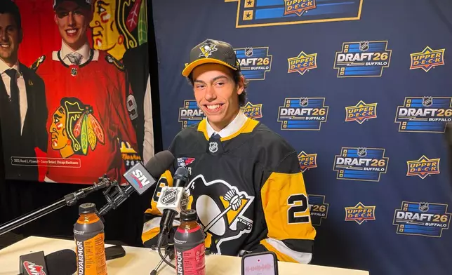 Medicine Hat center Markus Ruck addresses reporters after being selected by the Pittsburgh Penguins with the 39th pick at the NHL draft at the KeyBank Center in Buffalo, N.Y., on Saturday, June 27, 2026. (AP Photo/John Wawrow)