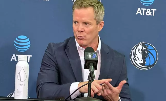 New Dallas Mavericks coach Dusty May addresses reporters during his introductory NBA basketball news conference in Dallas, Monday, June 29, 2026. (AP Photo/Schuyler Dixon)