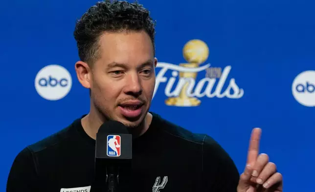 San Antonio Spurs head coach Mitch Johnson speaks during a news conference prior to Game 5 of the NBA Finals basketball series against the New York Knicks, Friday, June 12, 2026, in San Antonio. (AP Photo/Ross D. Franklin)