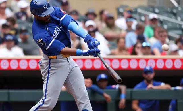 Kansas City Royals designated hitter Starling Marte hits a three-run home run against the Minnesota Twins during the fifth inning of a baseball game, Sunday, June 7, 2026, in Minneapolis. (AP Photo/Matt Krohn)