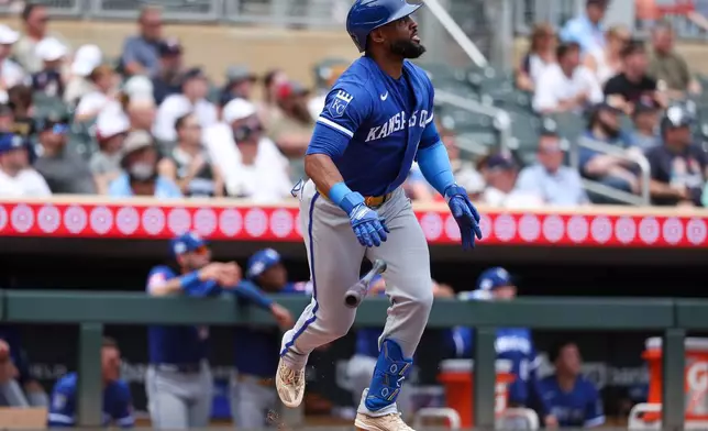 Kansas City Royals designated hitter Starling Marte watches his three-run home run against the Minnesota Twins during the fifth inning of a baseball game, Sunday, June 7, 2026, in Minneapolis. (AP Photo/Matt Krohn)