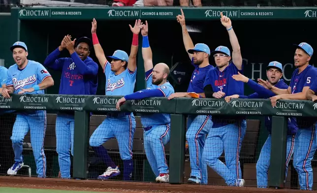 The Texas Rangers celebrate a Justin Foscue two-run home run in the first inning of a baseball game against the Cleveland Guardians in Arlington, Texas, Sunday, June 7, 2026. (AP Photo/Tony Gutierrez)