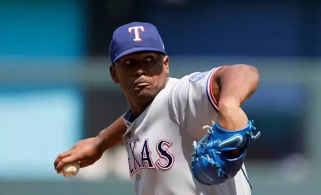 Texas Rangers pitcher Kumar Rocker delivers to a Kansas City Royals batter during the first inning of a baseball game in Kansas City, Mo., Thursday, June 11, 2026. (AP Photo/Colin E. Braley)