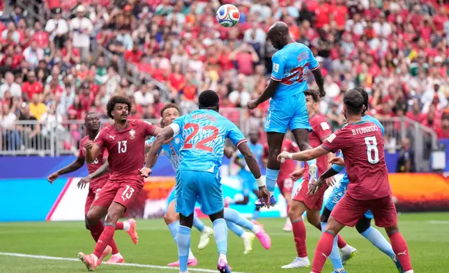 Congo's Yoane Wissa, top right, scores his side's first goal during the World Cup Group K soccer match between Portugal and Congo in Houston, Wednesday, June 17, 2026. (AP Photo/Ashley Landis)