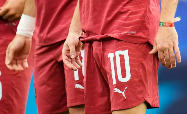 Portugal's Bernardo Silva (10) wears a bracelet in honor of late teammate Diogo Jota before the start of the World Cup Group K soccer match between Portugal and Congo in Houston, Wednesday, June 17, 2026. (AP Photo/Karen Warren)