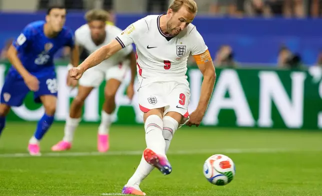 England's Harry Kane (9) scores his team's opening goal on a penalty kick during the World Cup Group L soccer match between England and Croatia in Arlington, Texas, near Dallas, Wednesday, June 17, 2026. (AP Photo/Tony Gutierrez)