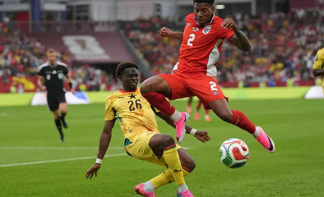 Panama's Cesar Blackman, right, jumps over the challenge from Ghana's Marvin Senaya during the World Cup Group L soccer match between Ghana and Panama in Toronto, Wednesday, June 17, 2026. (AP Photo/Stephanie Scarbrough)