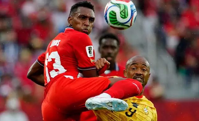 Panama's Jiovany Ramos (13) and Ghana's Jordan Ayew (9) vie for the ball during the World Cup Group L soccer match between Ghana and Panama in Toronto, Wednesday, June 17, 2026. (Frank Gunn/The Canadian Press via AP)