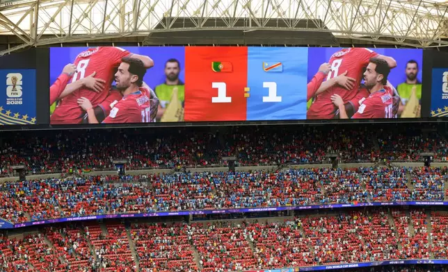 A 1-1 draw is displayed on a screen after the World Cup Group K soccer match between Portugal and Congo in Houston, Wednesday, June 17, 2026. (AP Photo/Michael Wyke)