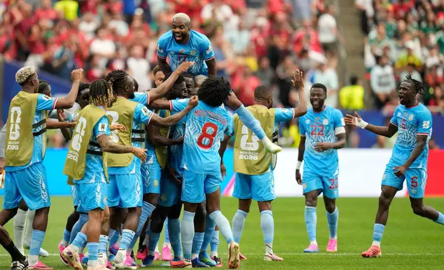 Congo players celebrate their side's first goal during the World Cup Group K soccer match between Portugal and Congo in Houston, Wednesday, June 17, 2026. (AP Photo/Karen Warren)