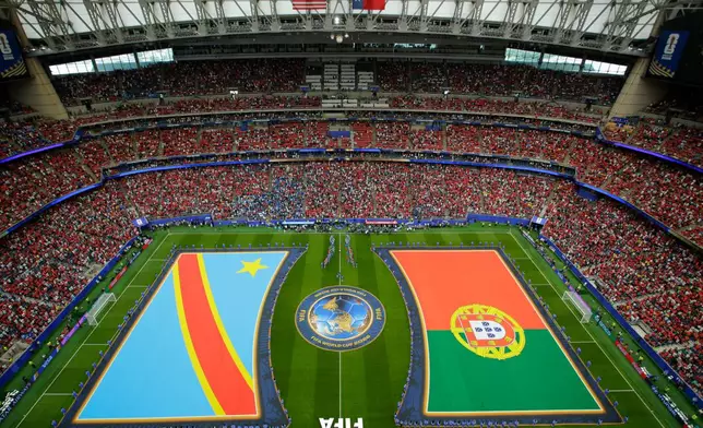 National flags are displayed on the field before the World Cup Group K soccer match between Portugal, right, and Congo in Houston, Wednesday, June 17, 2026. (AP Photo/Michael Wyke)