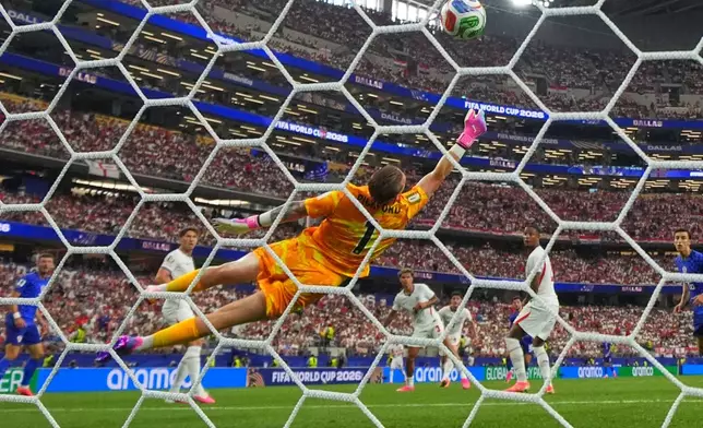 England goalkeeper Jordan Pickford (1) is beaten by a shot from Croatia's Martin Baturina (16) to score their first goal during the World Cup Group L soccer match between England and Croatia in Arlington, Texas, near Dallas, Wednesday, June 17, 2026. (AP Photo/Julio Cortez)