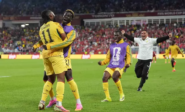 Ghana's Antoine Semenyo, left, celebrates after scoring the opening goal of his teammate Caleb Yirenkyi during the World Cup Group L soccer match between Ghana and Panama in Toronto, Wednesday, June 17, 2026. (AP Photo/Stephanie Scarbrough)