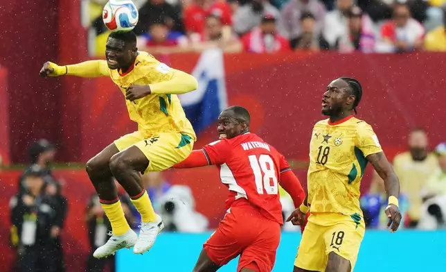 Ghana's Jonas Adjetey (4) heads the ball as Panama's Cecilio Waterman (18) and Ghana's Jerome Opoku look on during the World Cup Group L soccer match between Ghana and Panama in Toronto, Wednesday, June 17, 2026. (Nathan Denette/The Canadian Press via AP)