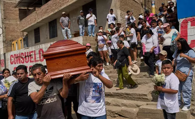 Relatives and friends carry the coffin of Gian Marco Garcia, who was killed by a hitman in El Porvenir, a district of Trujillo, Peru, Monday, May 25, 2026.(AP Photo/Rodrigo Abd)