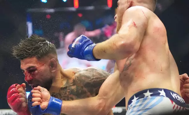 Ilia Toupruia, left, fights Justin Gaethje during UFC Freedom 250 on the South Lawn of the White House, Monday, June 15, 2026, in Washington. (AP Photo/Alex Brandon)