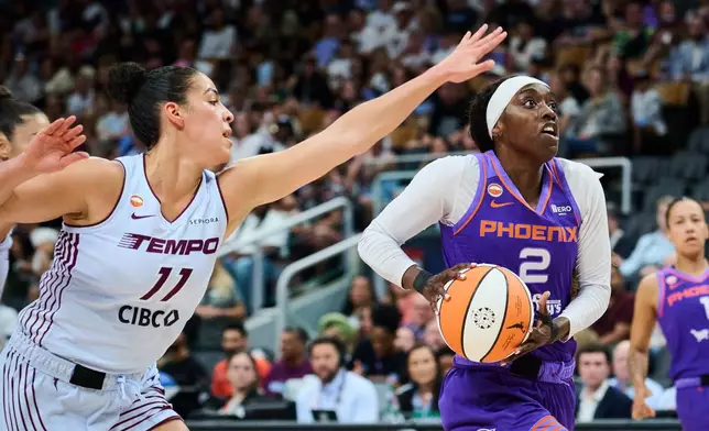 Phoenix Mercury's Kahleah Copper (2) drives to the net past Toronto Tempo's Kia Nurse (11) during first half of an WNBA basketball game in Toronto, on Saturday, June 27, 2026. (Sammy Kogan /The Canadian Press via AP)