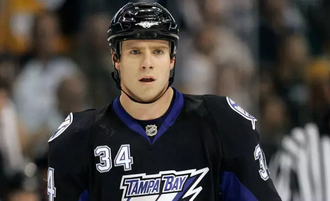 FILE - Tampa Bay Lightning's Ryan Craig looks on during a hockey game against the Carolina Hurricanes Wednesday night Nov. 14, 2007 in Tampa, Fla. (AP Photo/Chris O'Meara, File)