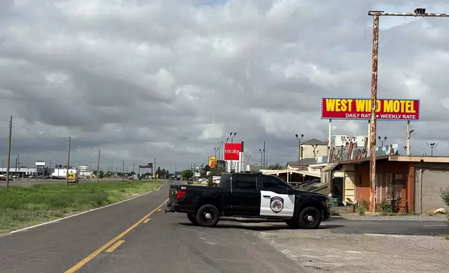 Law enforcement responds to an active shooting scene Friday, June 12, 2026, in Midland, Texas. (Luke Dias/Reporter-Telegram via AP)