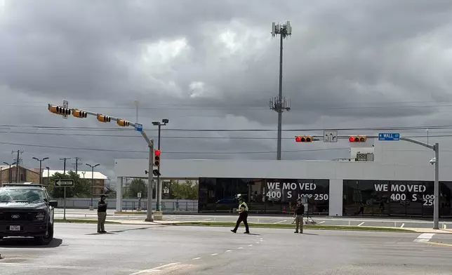 Law enforcement responds to an active shooting scene Friday, June 12, 2026, in Midland, Texas. (B. Kay Richter/Reporter-Telegram via AP)