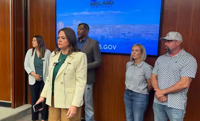 Councilwoman Amy Stretcher Burkes, Mayor Lori Blong, Councilman John Norman, Councilwoman-At-Large Robin Poole, and Councilman-At-Large John Burkholder provide information at a news conference about the active shooting on Friday, June 12, 2026, in Midland, Texas. (Luke Dias/Reporter-Telegram via AP)
