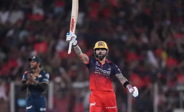 Royal Challengers Bengaluru's Virat Kohli celebrates his fifty runs during the Indian Premier League final cricket match between Gujarat Titans and Royal Challengers Bengaluru in Ahmedabad, India, Sunday, May 31, 2026. (AP Photo/Ajit Solanki)