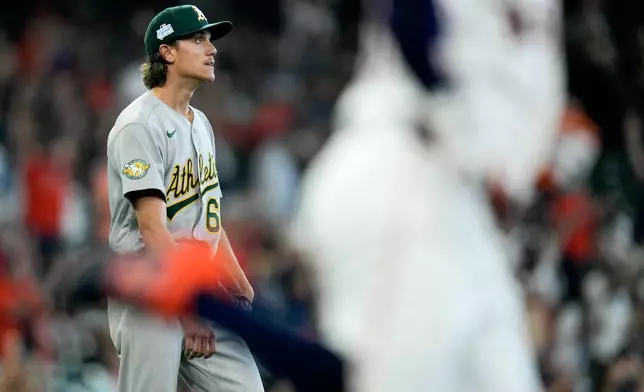 Athletics starting pitcher Kade Morris, left, watches a solo home run by Jose Altuve, right, during the third inning of a baseball game, Saturday, June 6, 2026, in Houston. (AP Photo/Eric Christian Smith)