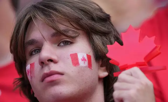 A Canadian fan sits in the stands as he waits for the start of the World Cup Group B soccer match between Canada and Bosnia in Toronto, Friday, June 12, 2026. (AP Photo/Stephanie Scarbrough)