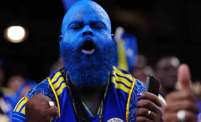 Curacao fans on the stands wait for the start of the World Cup Group E soccer match between Germany and Curacao in Houston, Sunday, June 14, 2026. (AP Photo/Karen Warren)