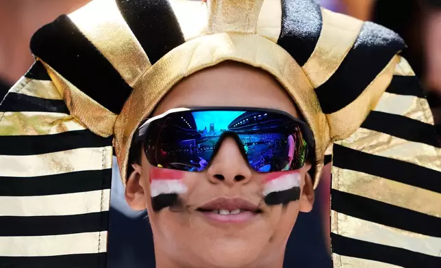 An Egypt fan smiles in the stands before the World Cup Group G soccer match between Egypt and Belgium in Seattle, Monday, June 15, 2026. (AP Photo/Lindsey Wasson)