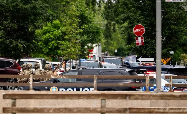 Montreal police work the scene of a shooting in Montreal on Monday, June 22, 2026. (Christopher Katsarov/The Canadian Press via AP)