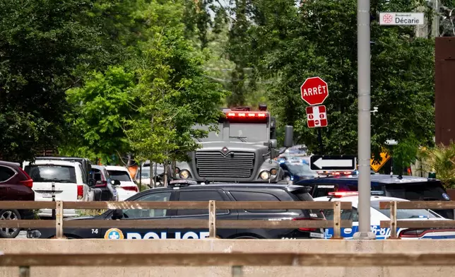 Montreal police work the scene of a shooting in Montreal on Monday, June 22, 2026. (Christopher Katsarov/The Canadian Press via AP)