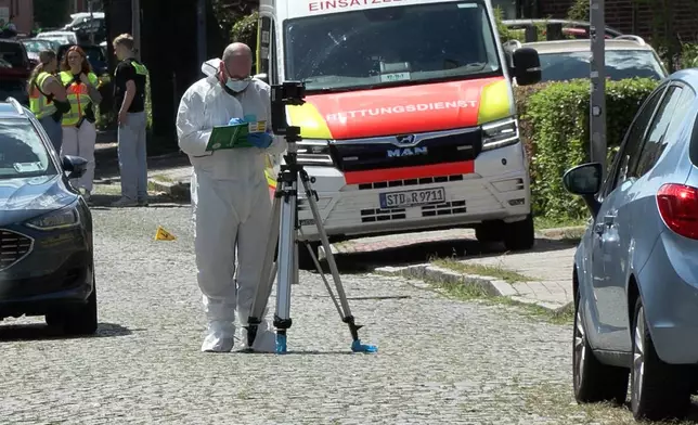 Emergency responders and forensic investigators in Stade, Germany, Monday, June 29, 2026 as police say five people have been killed in a shooting. (Fabian Höfig/NEWS5/dpa via AP)