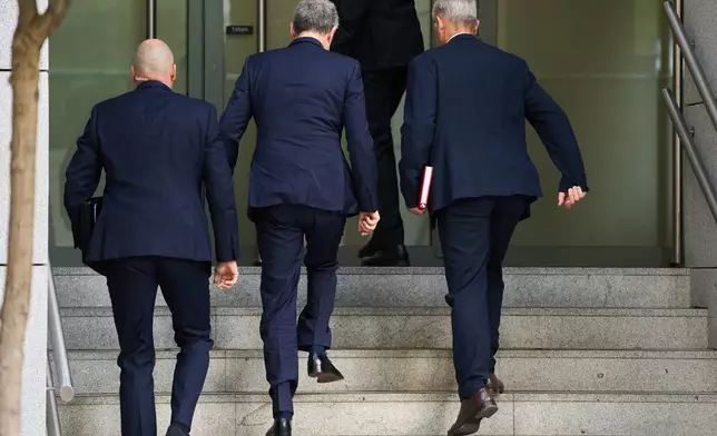Former Spanish Prime Minister José Luis Rodríguez Zapatero, center, arrives at the National Court to be questioned by a judge in an investigation into alleged influence peddling and other possible crimes related to the government's bailout of an airline, in Madrid, Spain, Wednesday, June 17, 2026. (AP Photo/Bernat Armangue)
