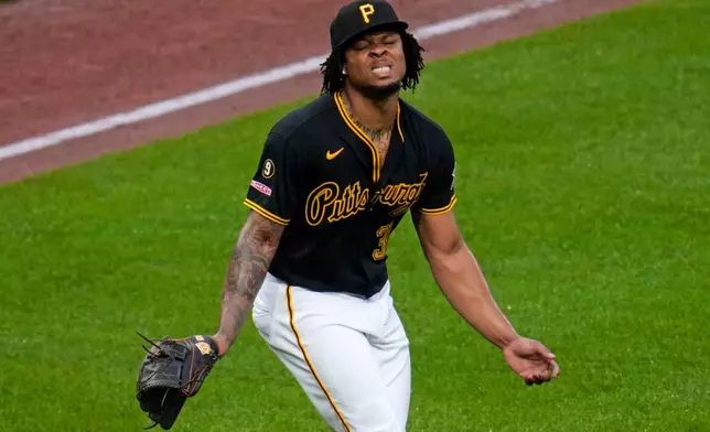 Pittsburgh Pirates pitcher Gregory Soto reacts to giving up a three-run home run to Cincinnati Reds' Eugenio Suárez during the ninth inning of a baseball game in Pittsburgh, Saturday, June 27, 2026. (AP Photo/Gene J. Puskar)