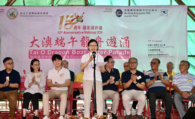 Club Steward Anita Fung delivers a speech at the Tai O Dragon Boat Water Parade.