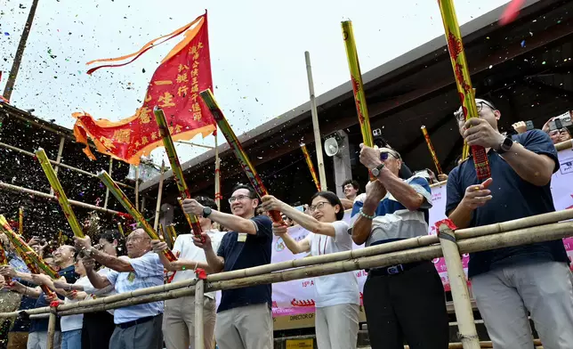 Guests fire the ceremonial cannon at the Tai O Dragon Boat Water Parade.