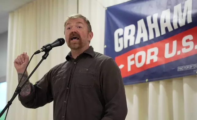 Graham Platner, Democratic candidate for U.S. Senate, speaks to an overflow crowd outside a campaign event Sunday, June 7, 2026, in Portland, Maine. (AP Photo/Robert F. Bukaty)