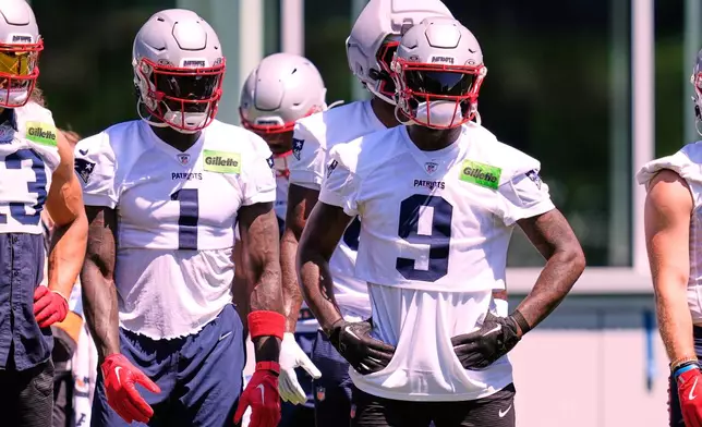 New England Patriot's Kayshon Boutte (9) stands with teammate A.J Brown (1) during an NFL football practice, Tuesday, June 9, 2026, in Foxborough, Mass. (AP Photo/Charles Krupa)