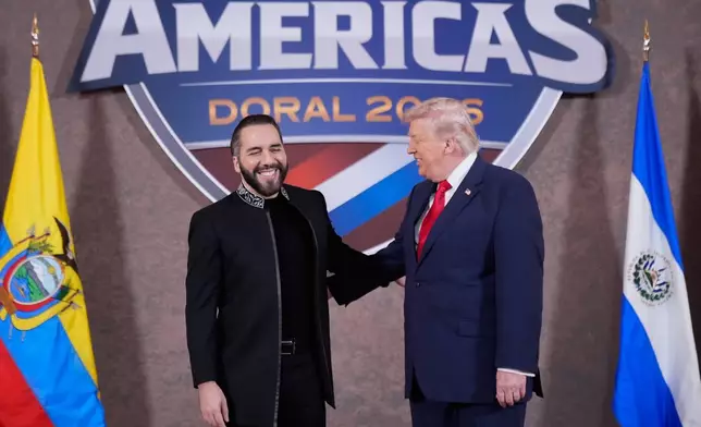 FILE - President of El Salvador Nayib Bukele greets President Donald Trump at the Shield of the Americas Summit at Trump National Doral Miami in Doral, Fla., March 7, 2026, (AP Photo/Mark Schiefelbein, File)