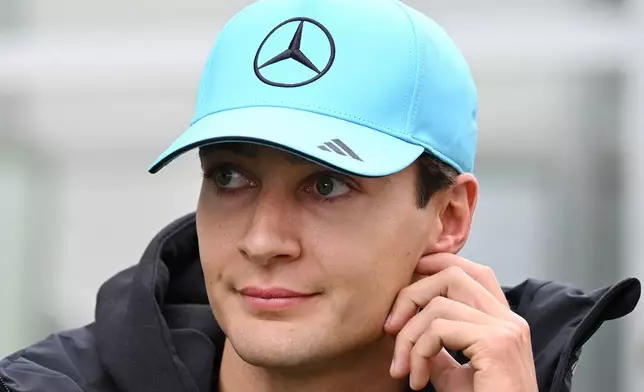Mercedes driver George Russell, of Britain, walks through the paddock at the F1 Canadian Grand Prix auto race in Montreal, Sunday, May 24, 2026. (Graham Hughes/The Canadian Press via AP)