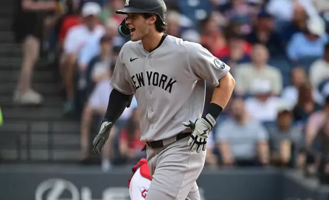 New York Yankees' Spencer Jones celebrates after hitting a two-run home run off Cleveland Guardians starting pitcher Slade Cecconi during the second inning of a baseball game, Tuesday, June 9, 2026, in Cleveland. (AP Photo/David Dermer)