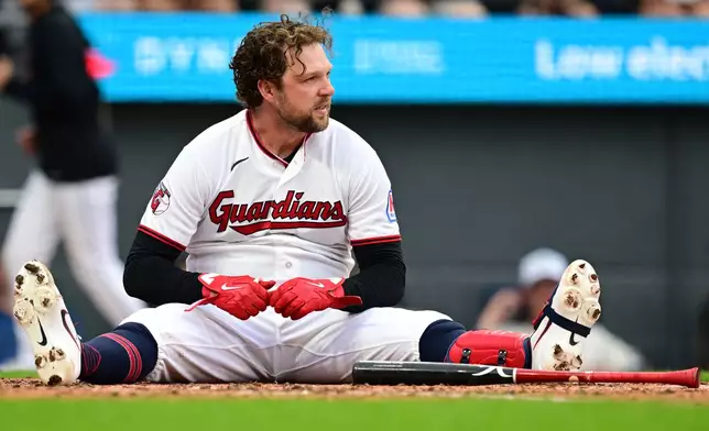 Cleveland Guardians' Rhys Hoskins reacts after being hit by a pitch by from New York Yankees starting pitcher Gerrit Cole during the third inning of a baseball game, Tuesday, June 9, 2026, in Cleveland. (AP Photo/David Dermer)
